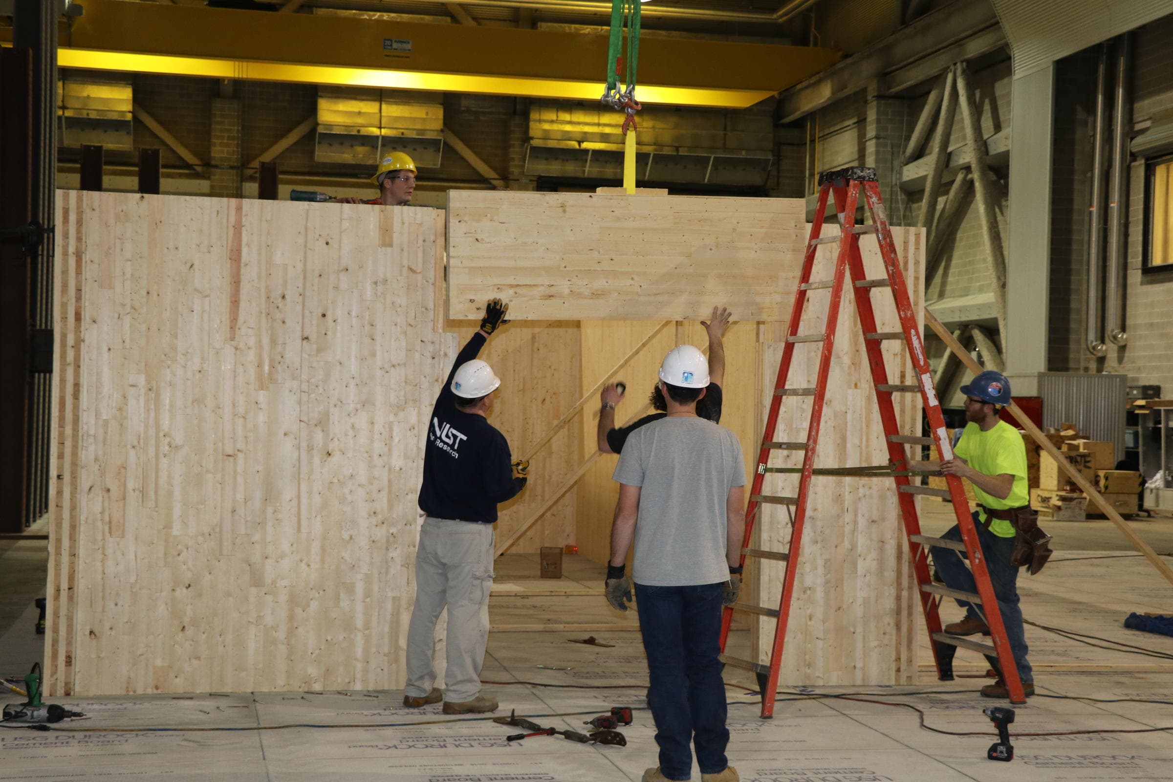 Cross-laminated timber panels forming the walls and ceiling of a test compartment.