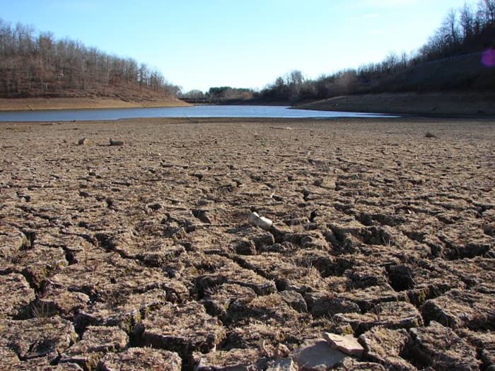 A dry, cracked lakebed during drought conditions.