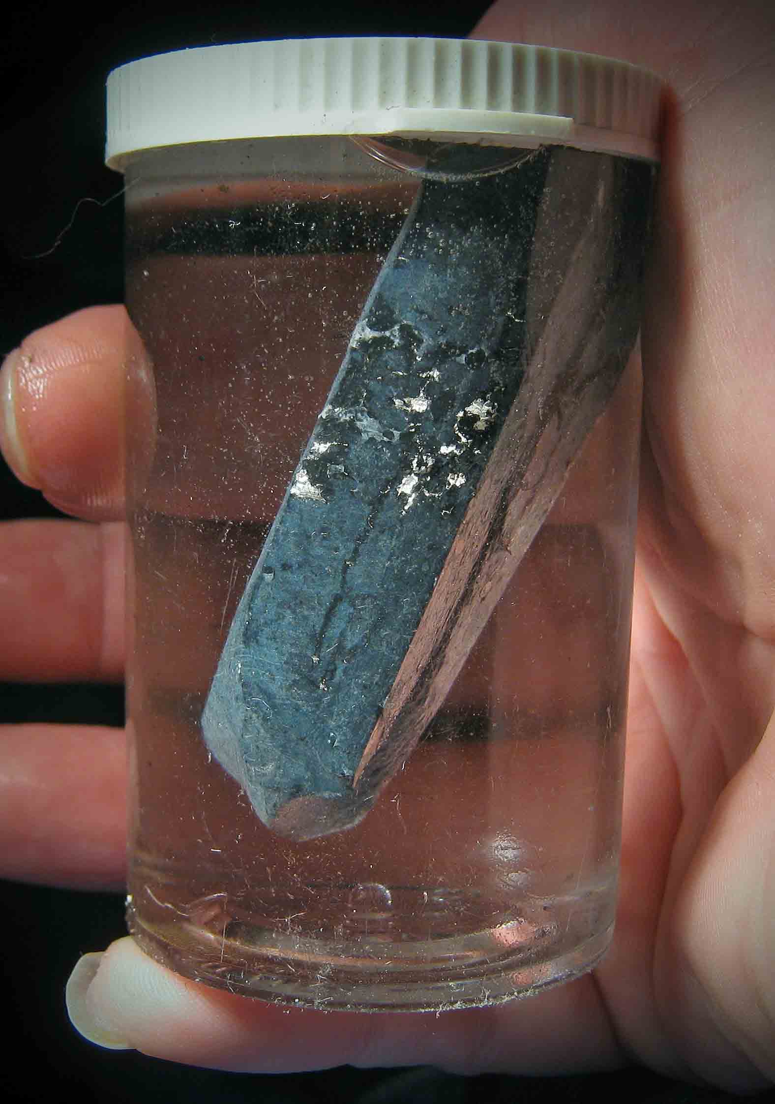 Small pieces of lithium metal floating in mineral oil