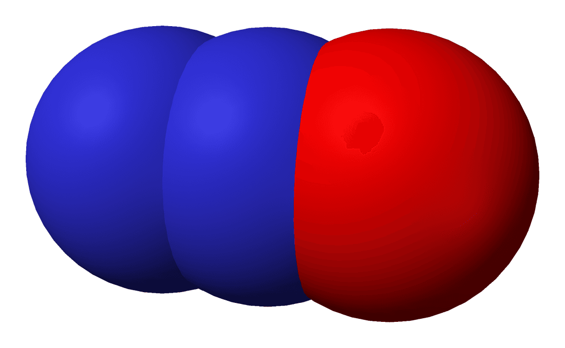 A space-filling model of a nitrous oxide molecule with two nitrogen atoms and one oxygen atom.