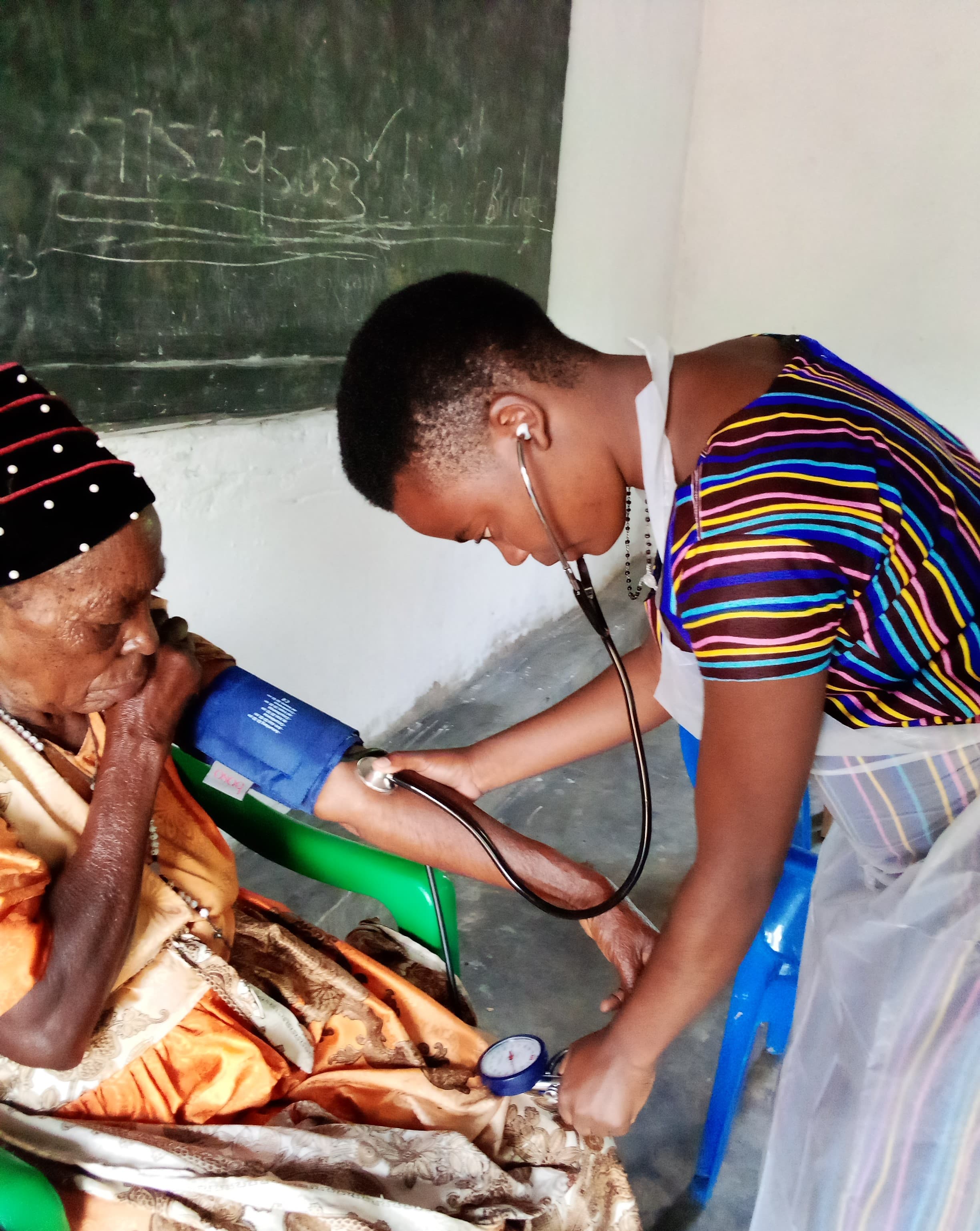 Nurse attending to a patient in a care setting