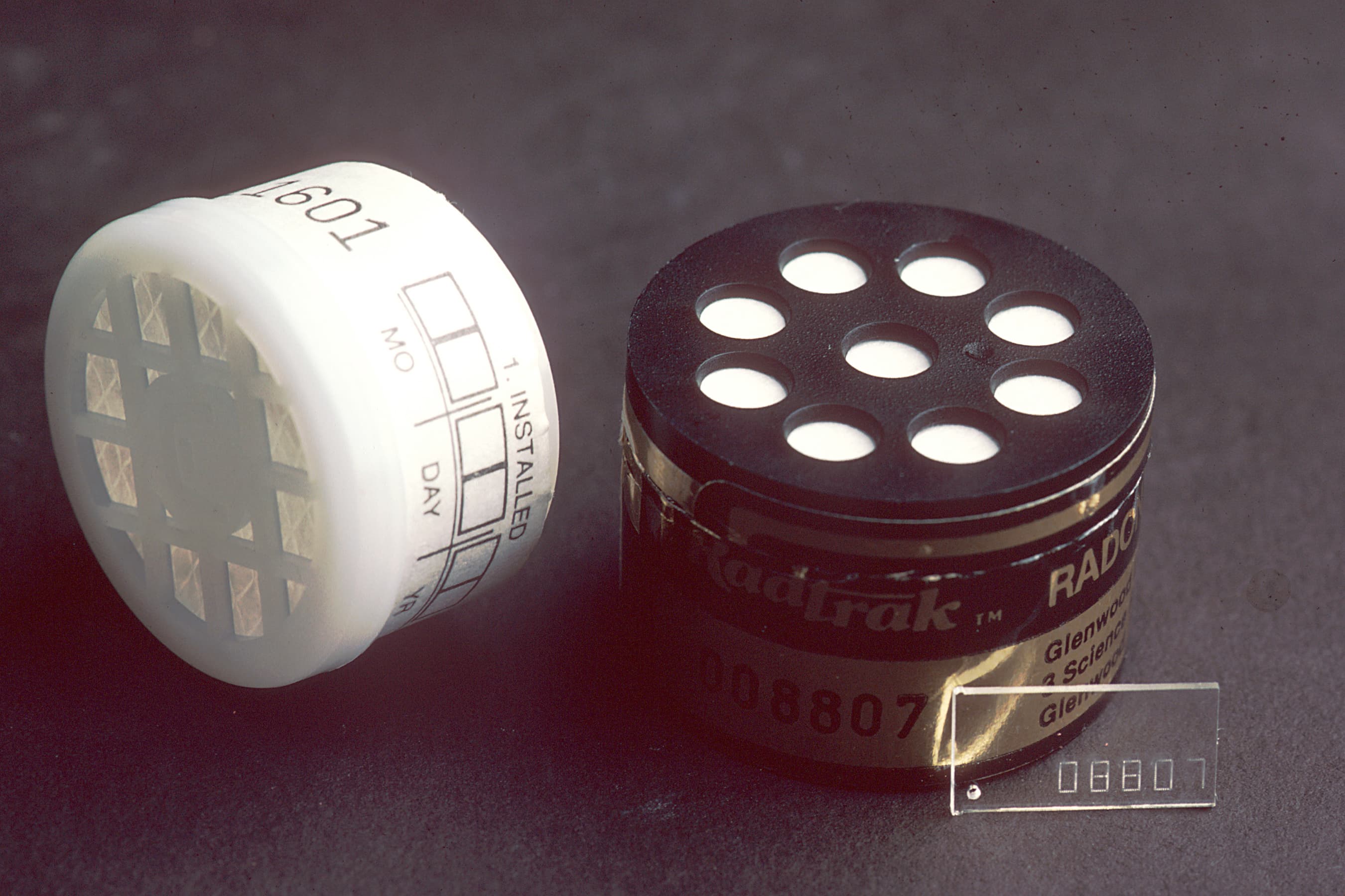 A radon test kit packet used to measure radon levels in a building.