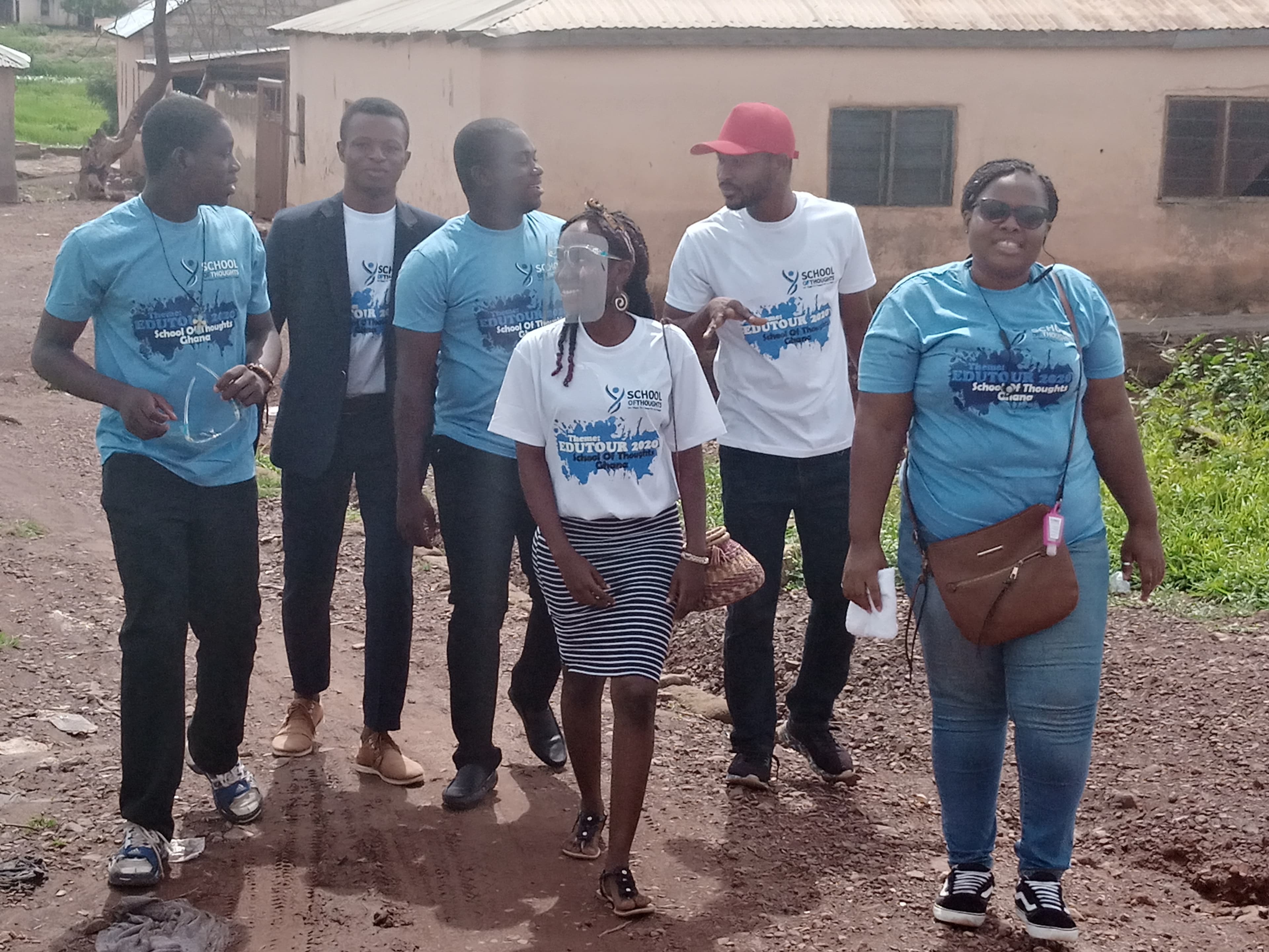 A group of young people volunteering together in a community service setting.