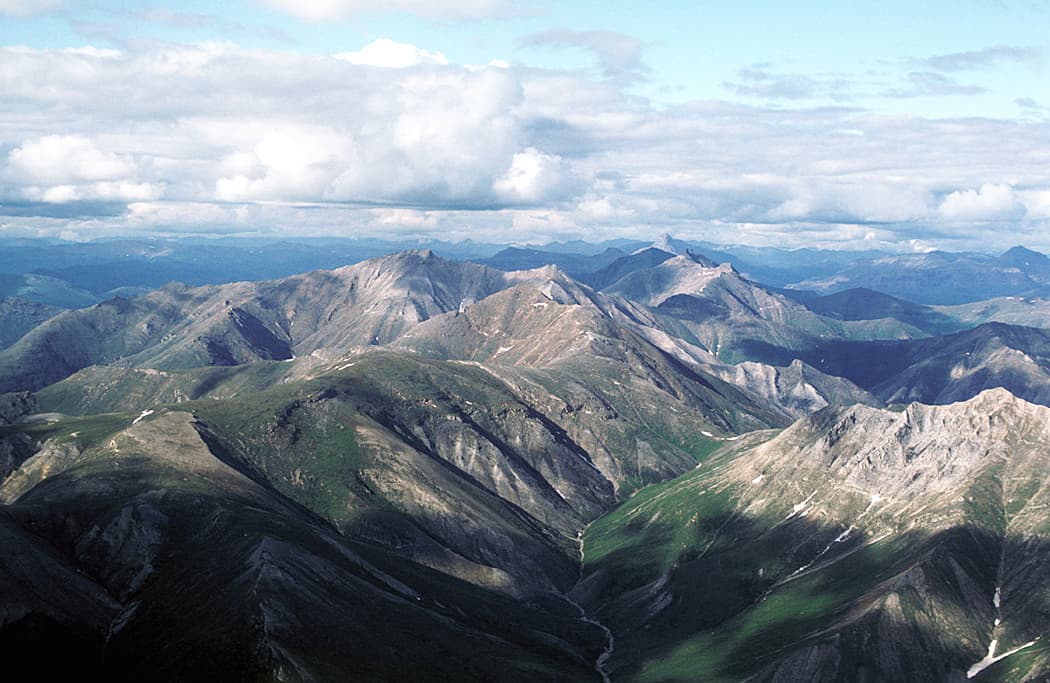 Aerial view of summer tundra and mountains in Gates of the Arctic National Park and Preserve, Alaska.